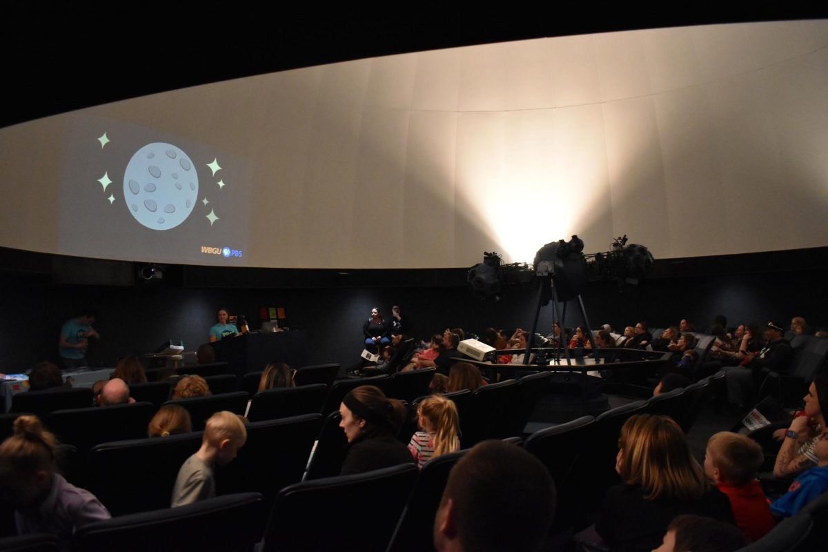 Planetarium audiences take in the show.