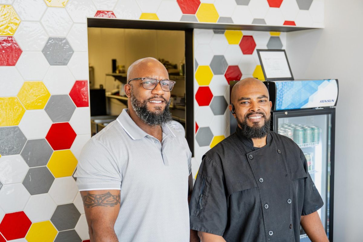 Head Chef Larry Johnson, right, works with his ex-brother-in-law, Michael Drane, left. Drane is the operational general manager for Grub Guys. 