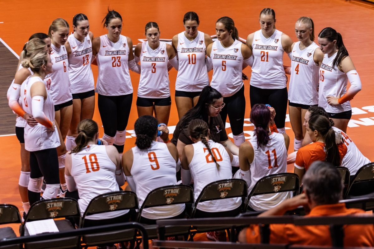 Bowling Green, OH - Falcons volleyball players go over an upcoming attack during a media timeout at the Stroh Center in Bowling Green, Ohio.