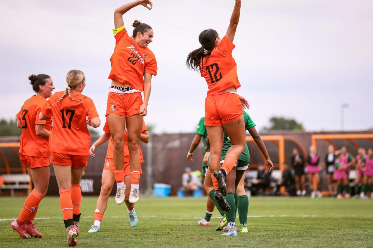 Bowling Green, OH - Falcons junior defender Taylor Green (22, left) and midfielder Gabby Lamparty (12, right) celebrate following a goal at Cochrane Stadium in Bowling Green, Ohio.
