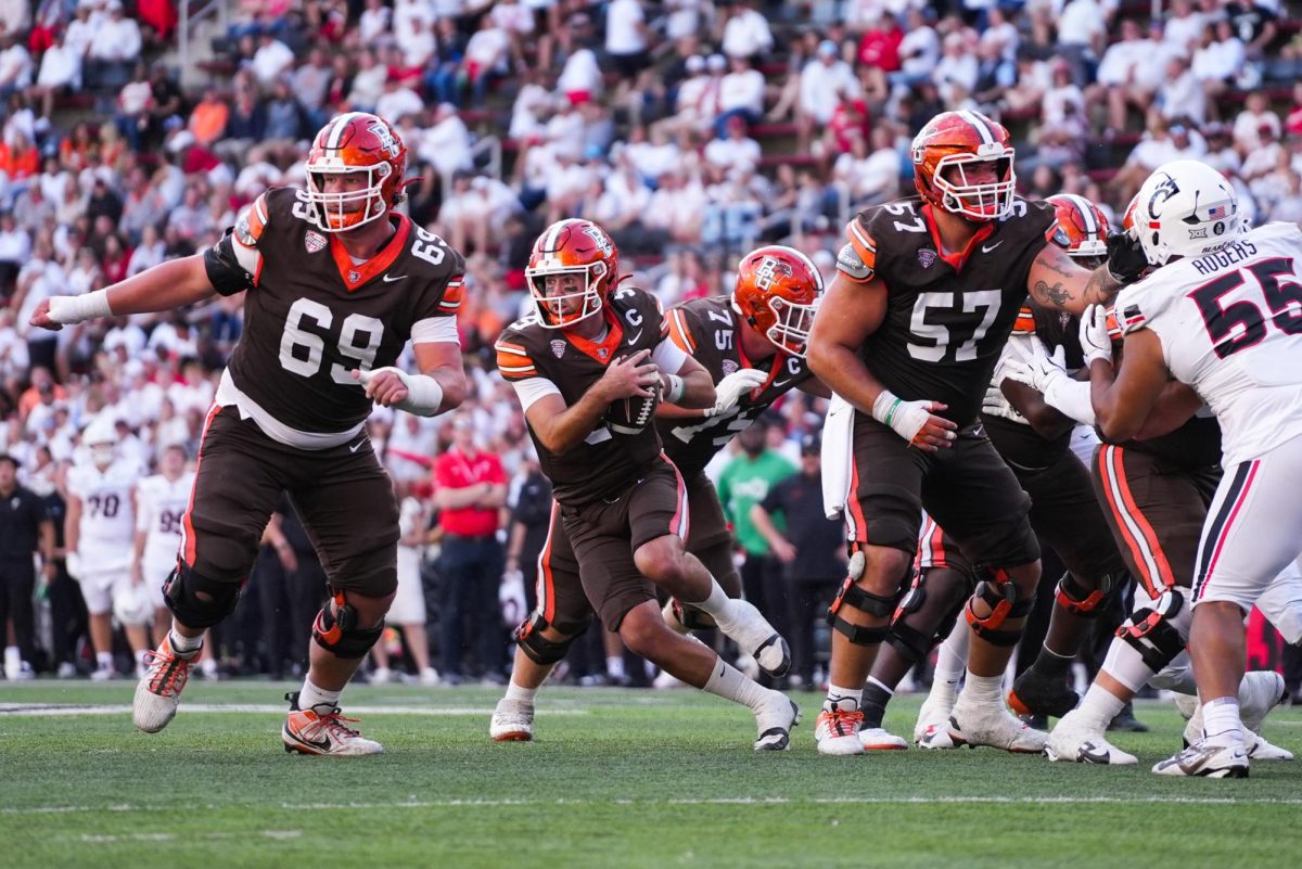 Cincinnati, OH - Falcons graduate quarterback Drew Pyne (9) rushing the ball at Nippert Stadium in Cincinnati, Ohio.