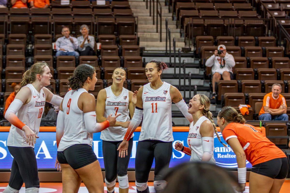 Bowling Green, OH - The Falcons celebrate after a crucial point in the last set of the game against the Bobcats at the Stroh Center in Bowling Green, Ohio.