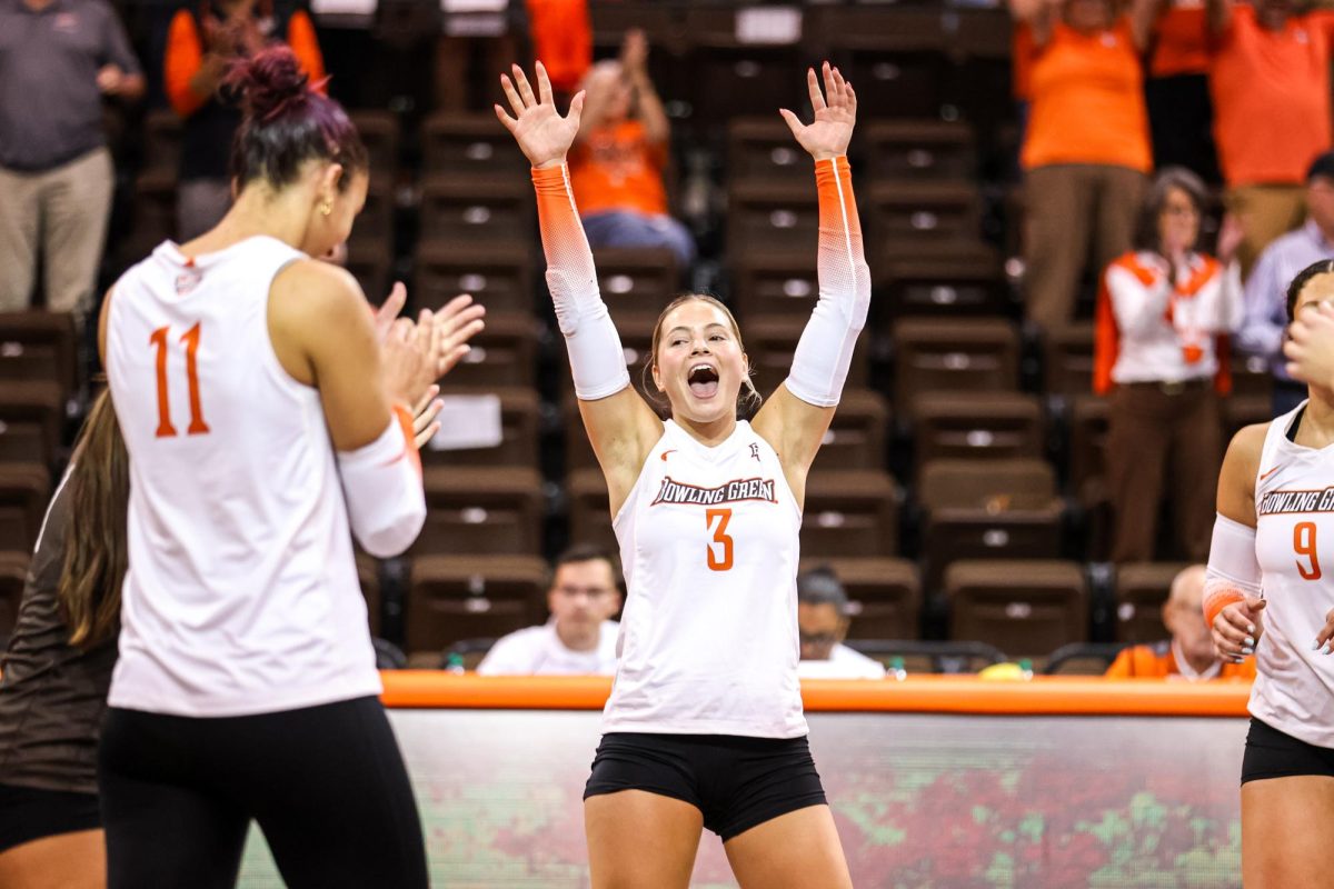Bowling Green - Falcons sophomore defensive specialist Avery Anders (3) celebrates after defeating the Oakland Grizzlies at the Stroh Center in Bowling Green, Ohio.