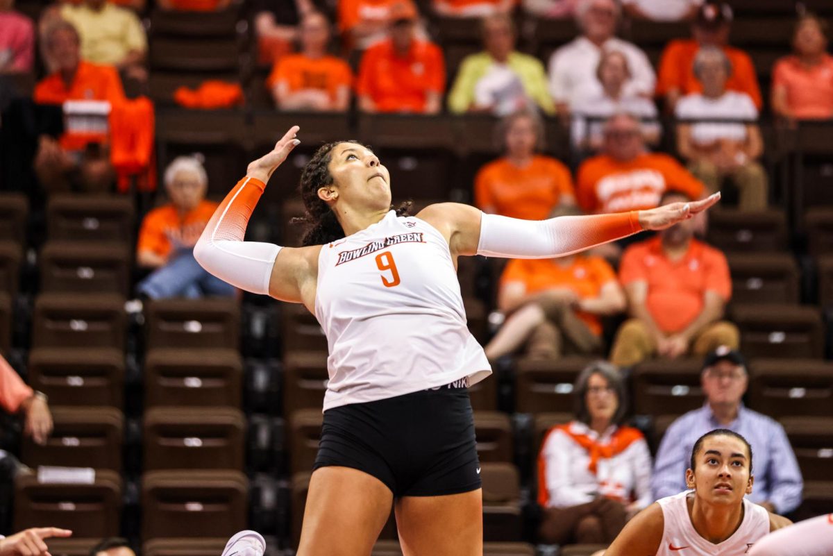 Bowling Green - Falcons junior outside hitter Avery Hobson (9) prepares to send the ball over the net at the Stroh Center in Bowling Green, Ohio.