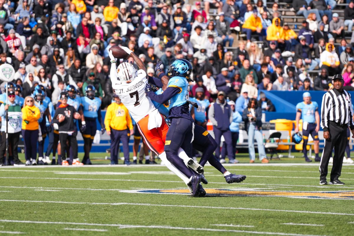 Kent, OH - Falcons senior tight end Jyrin Johnson (7) making the diving catch at Dix Stadium in Kent, Ohio.