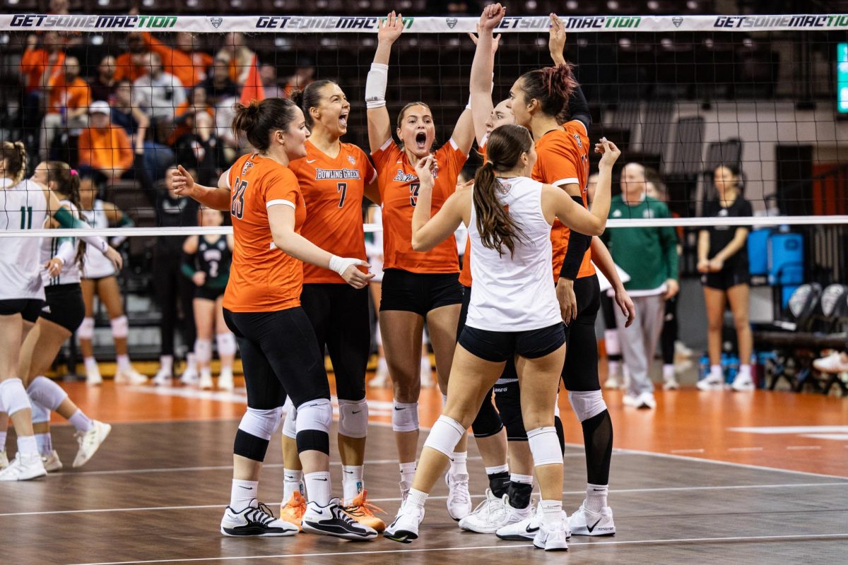  Bowling Green, OH - The Falcons celebrate a point in the MAC Tournament at the Stroh Center in Bowling Green, Ohio.