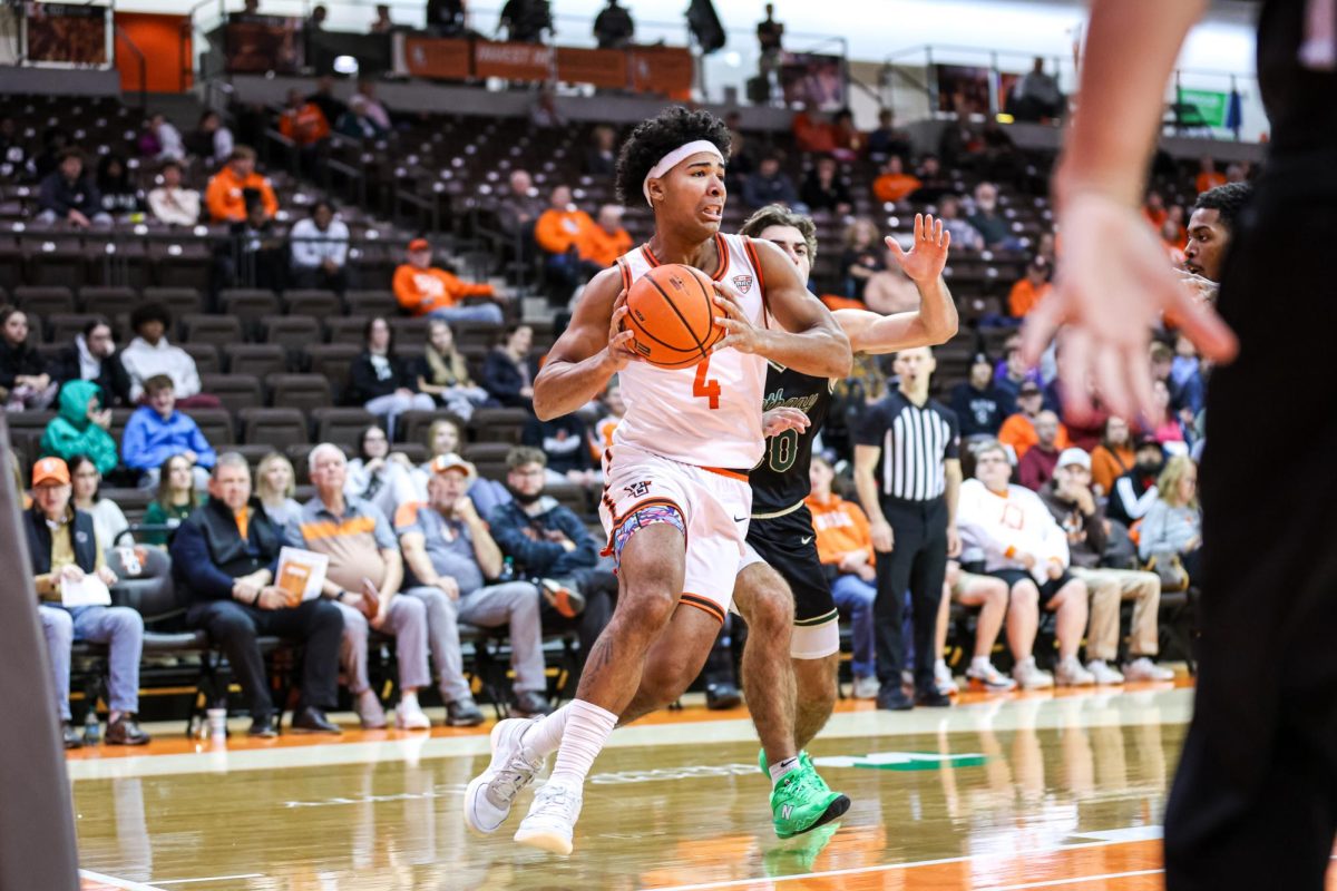 Bowling Green, OH - Falcons sophomore guard Josiah Shackelford (4) makes a push towards the basket against the Bison at the Stroh Center in Bowling Green, Ohio.