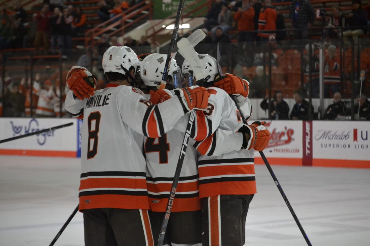 Bowling Green, OH - Falcons celebrating the game winning goal at the Slater Family Ice Arena in Bowling Green, Ohio.