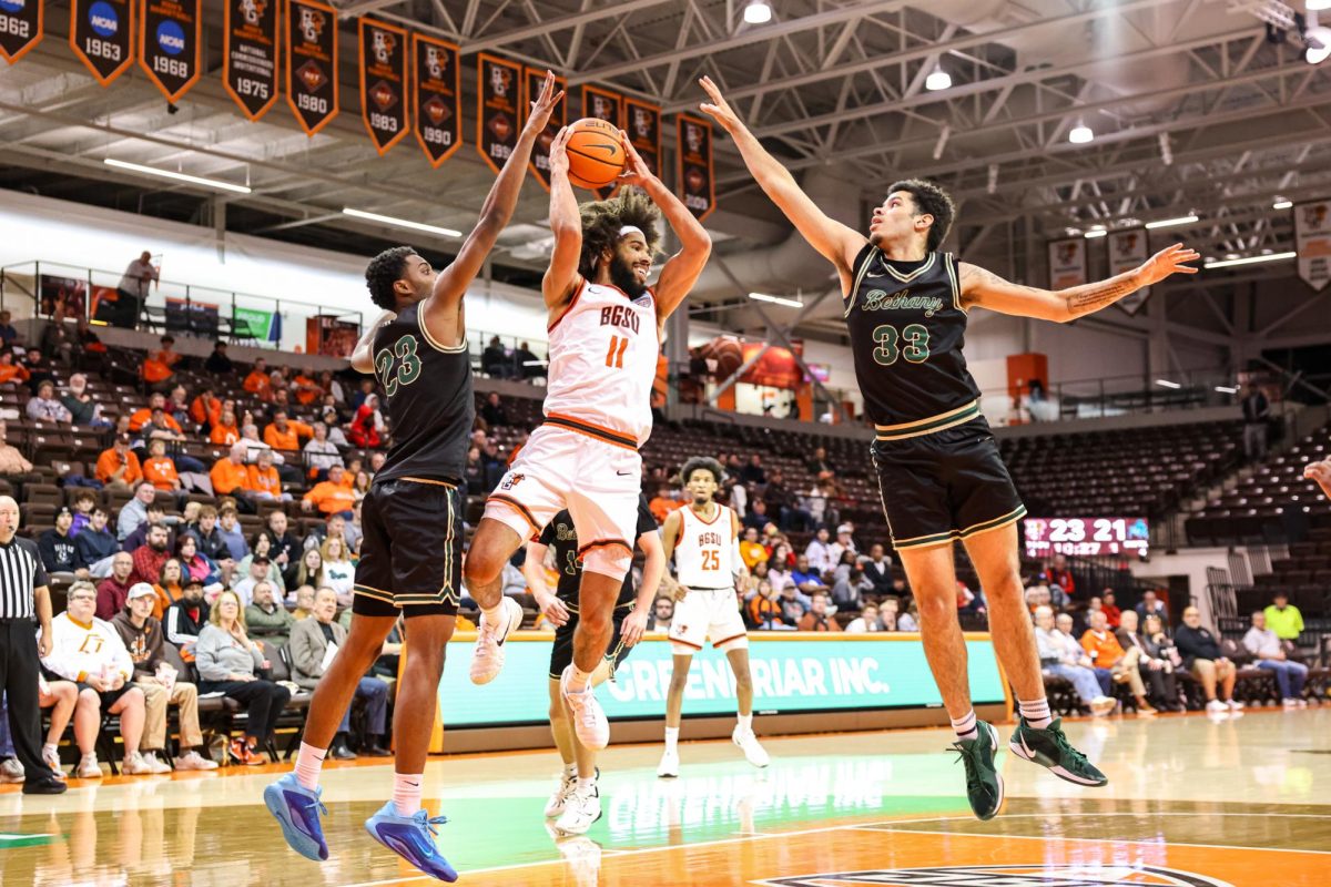Bowling Green, OH - Falcons senior guard Javon Ruffin (11) prepares to pass the ball at the Stroh Center in Bowling Green, Ohio.