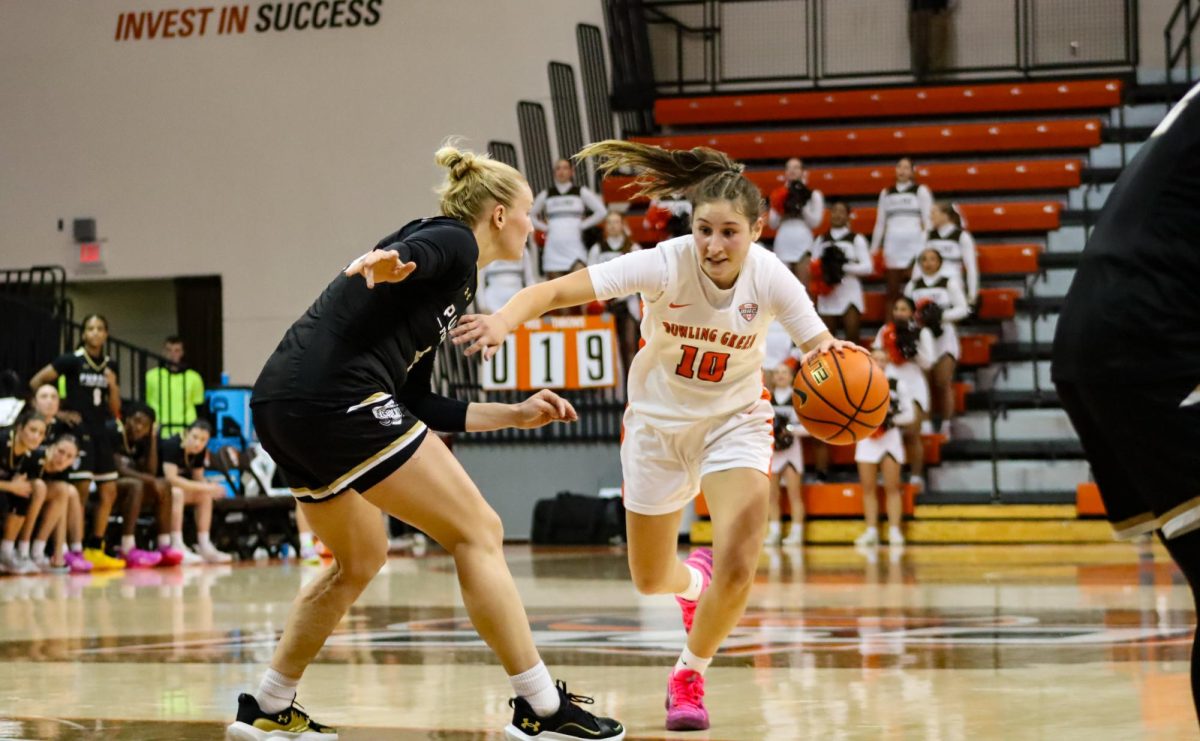 Bowling Green, OH - Falcons junior guard Paige Kohler (10) attempts to break away from the Purdue Fort Wayne defense at the Stroh Center in Bowling Green, Ohio.