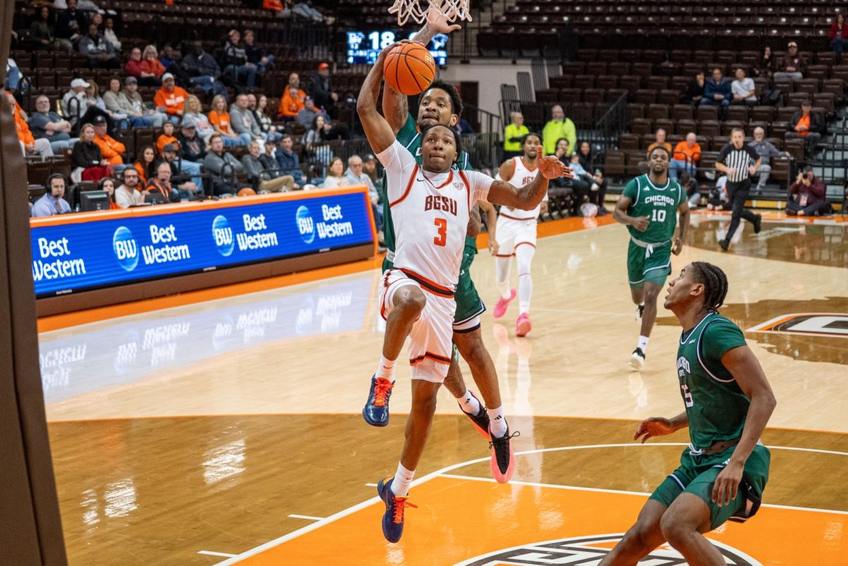 Bowling Green, OH - Falcons freshman guard Makhi Leach (3) going for the dunk at the Stroh Center in Bowling Green, Ohio.