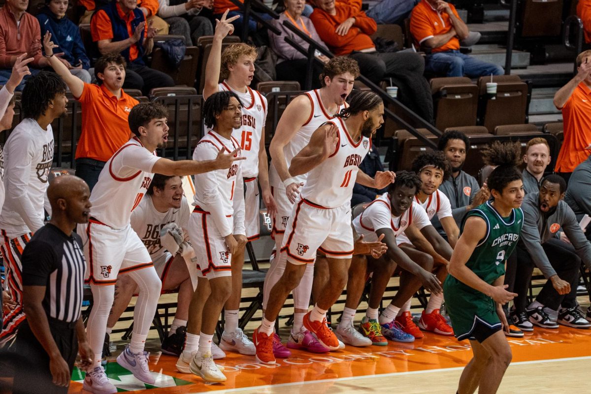 Bowling Green, OH - Falcons bench celebrating with senior guard Javon Ruffin (11) after a clutch three-pointer at the Stroh Center in Bowling Green, Ohio.
