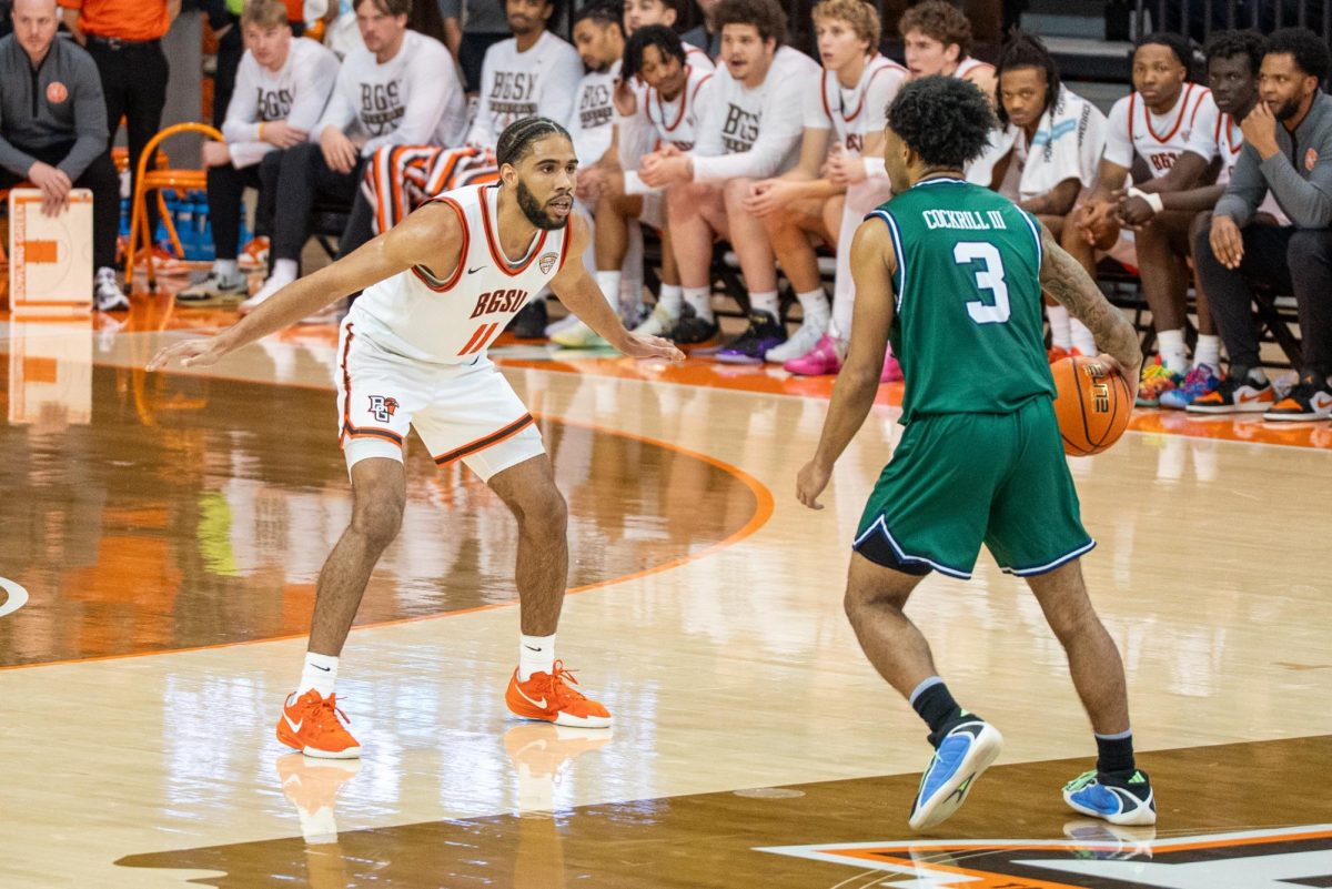 Bowling Green, OH - Falcons senior guard Javon Ruffin (11) pressing the Chicago State offense at the Stroh Center in Bowling Green, Ohio.