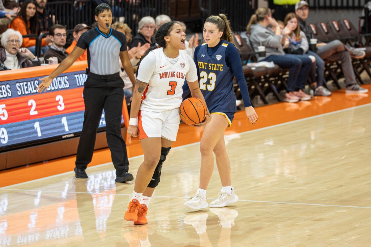 Bowling Green, OH - Falcons sophomore guard Johnea Donahue (3) celebrating after a clutch 3-pointer before the end of the first half at the Stroh Center in Bowling Green, Ohio.