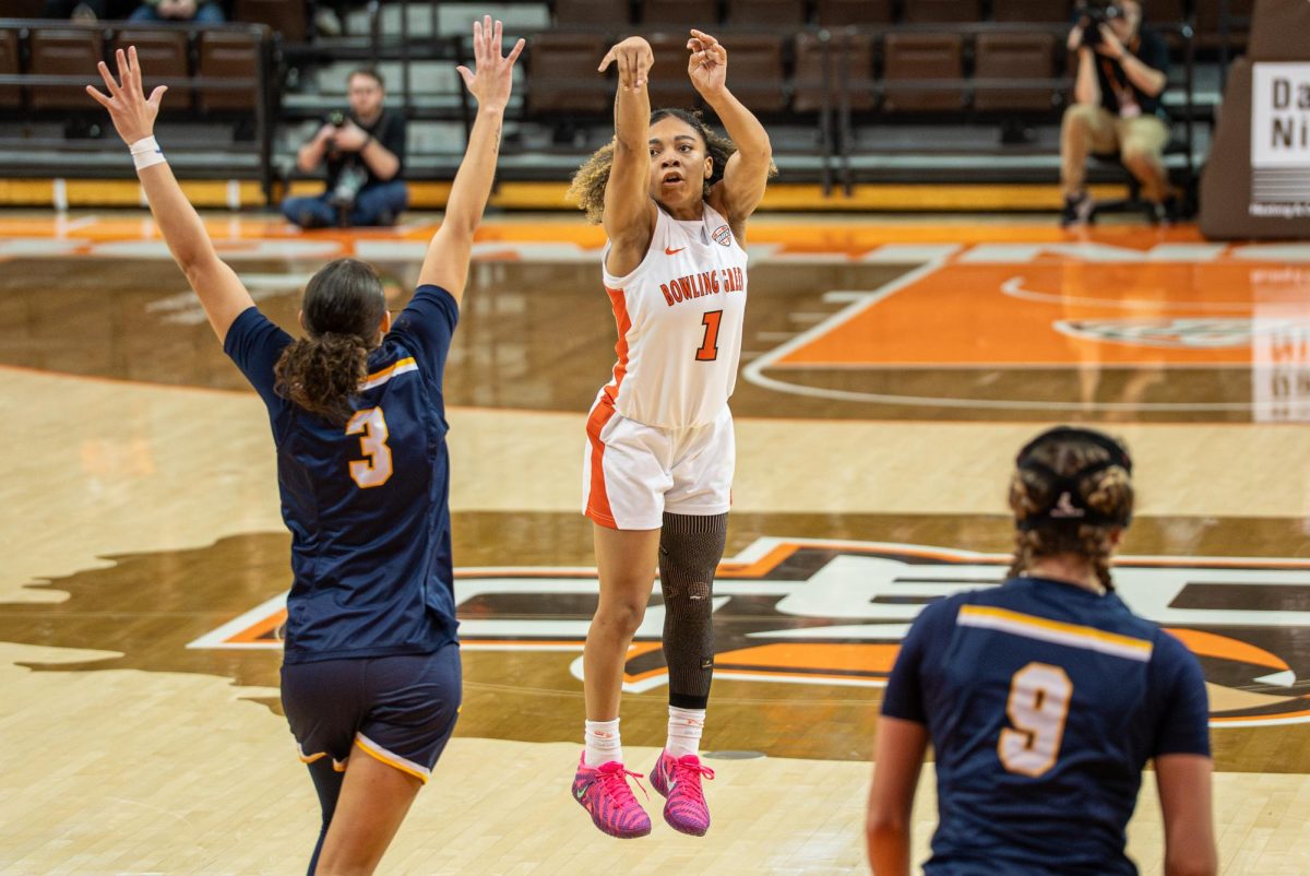 Bowling Green, OH - Falcons senior guard Kaia Woods (1) shooting from deep at the Stroh Center in Bowling Green, Ohio.