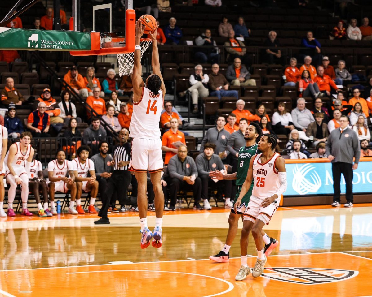  Bowling Green, OH - Falcons senior forward Sam Towns (14) slams one home during a game between the Chicago State Cougars and the Bowling Green Falcons at the Stroh Center in Bowling Green, Ohio.