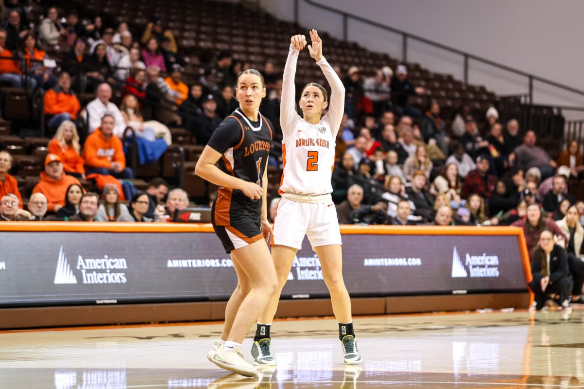 Bowling Green, OH - Falcons senior guard Emily Siesel (2) splashes a three point shot at the Stroh Center in Bowling Green, Ohio.