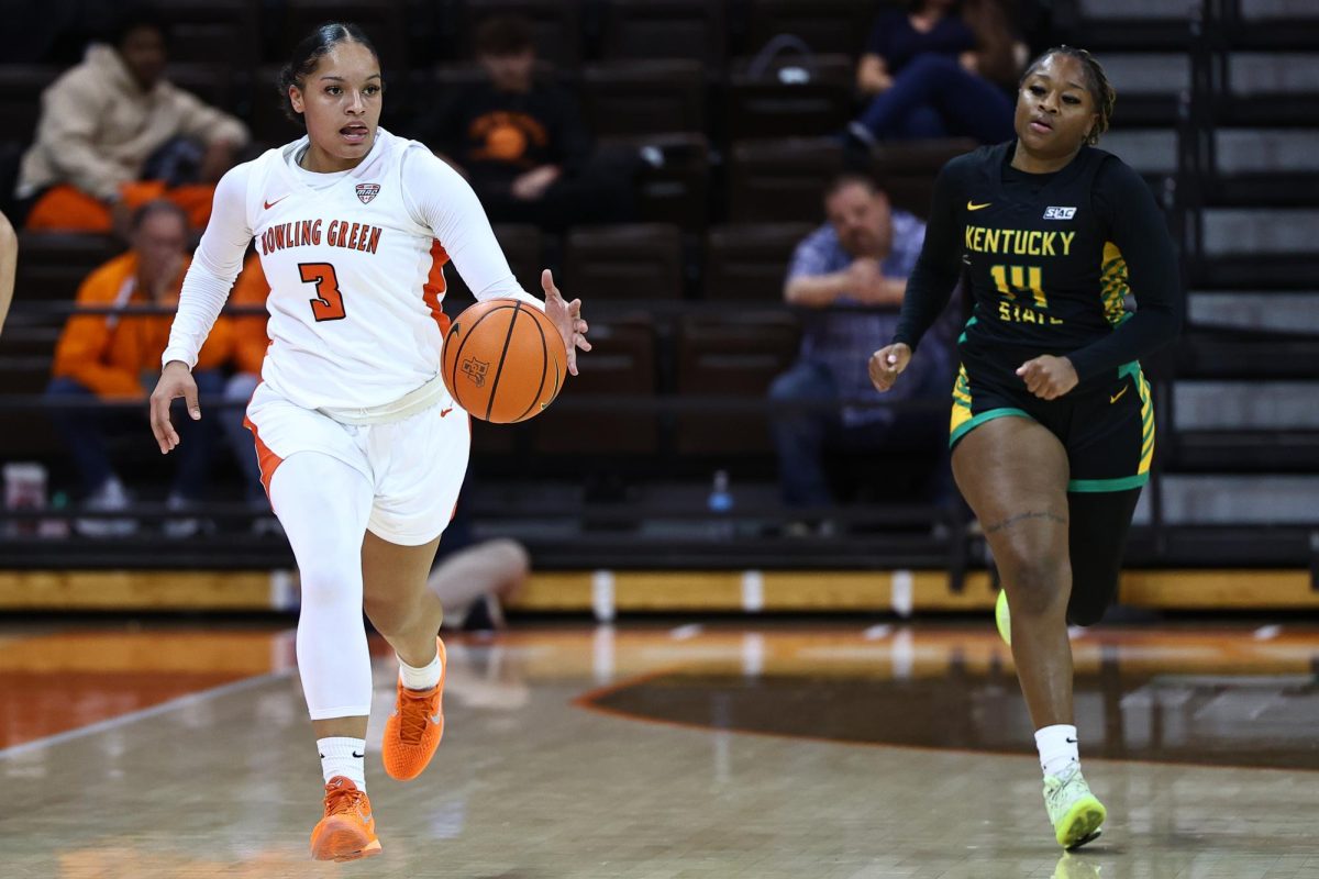 Bowling Green, OH - Falcons sophomore guard Johnea Donahue (3) attempts to defeat Thorobreds senior guard Amyah Adair-Mars (14) in a footrace during a game between the Kentucky State Thorobreds and the Bowling Green Falcons at the Stroh Center in Bowling Green, Ohio.