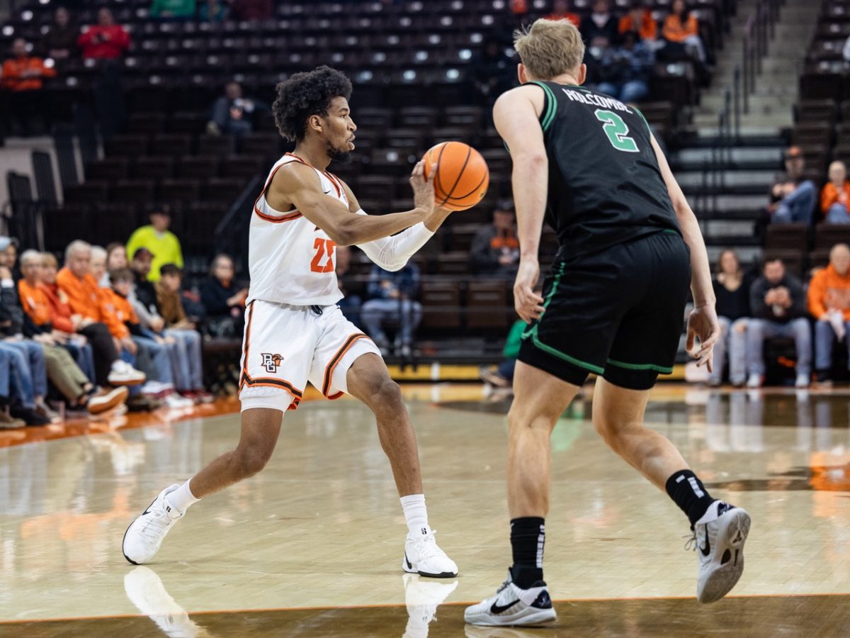 Bowling Green, OH - Falcons senior guard Justin Thomas (25) looks to pass during a game between the Utah Valley Wolverines and the Bowling Green Falcons at the Stroh Center in Bowling Green, Ohio.