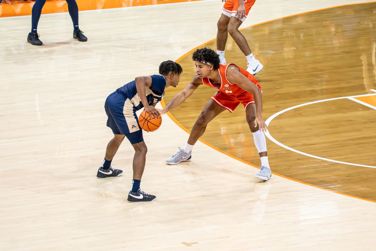 Bowling Green, OH - Falcons sophomore guard Josiah Shackelford (4) defending an University of Akron player at the Stroh Center in Bowling Green, Ohio.