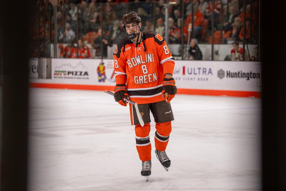 Bowling Green, OH - Falcons Jérémie Minville (8) leaving the ice after both teams were issued game misconducts for fighting at Slater Family Ice Arena in Bowling Green, Ohio.