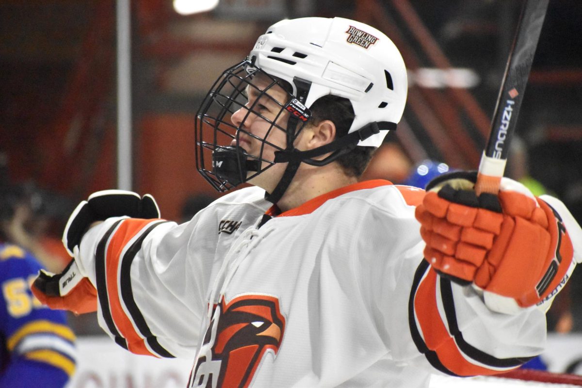 Bowling Green, OH - Falcons senior forward Quinn Emerson (18) celebrates after opening the scoring in a match against Lake Superior State at Slater Family Ice Arena in Bowling Green, Ohio.