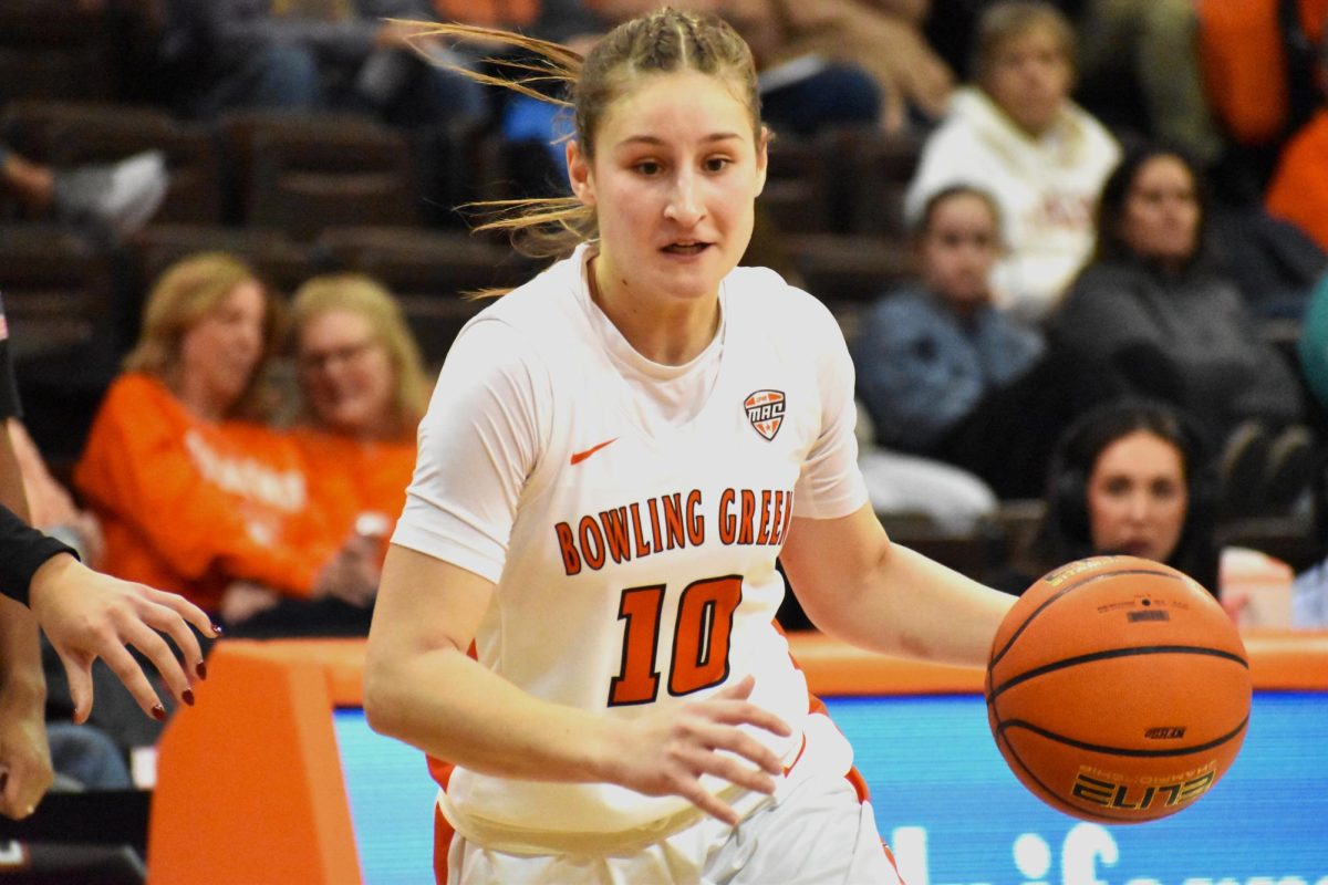 Bowling Green, OH - Falcons senior guard Paige Kohler (10) dribbles the ball in a game against Ohio University at the Stroh Center in Bowling Green, OH.