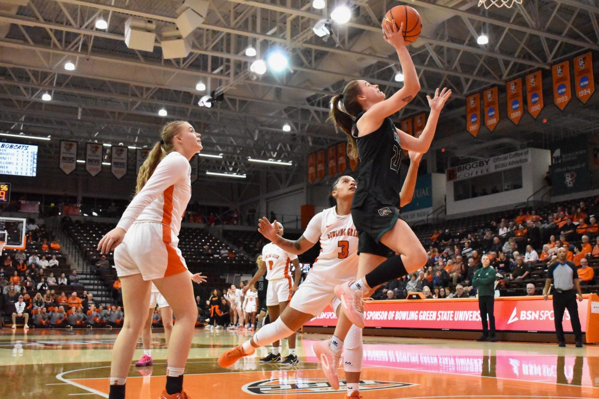 Bowling Green, OH - Bobcats junior guard Bailey Tabeling (21) goes for a shot during a game against BGSU at the Stroh Center in Bowling Green, Oh.