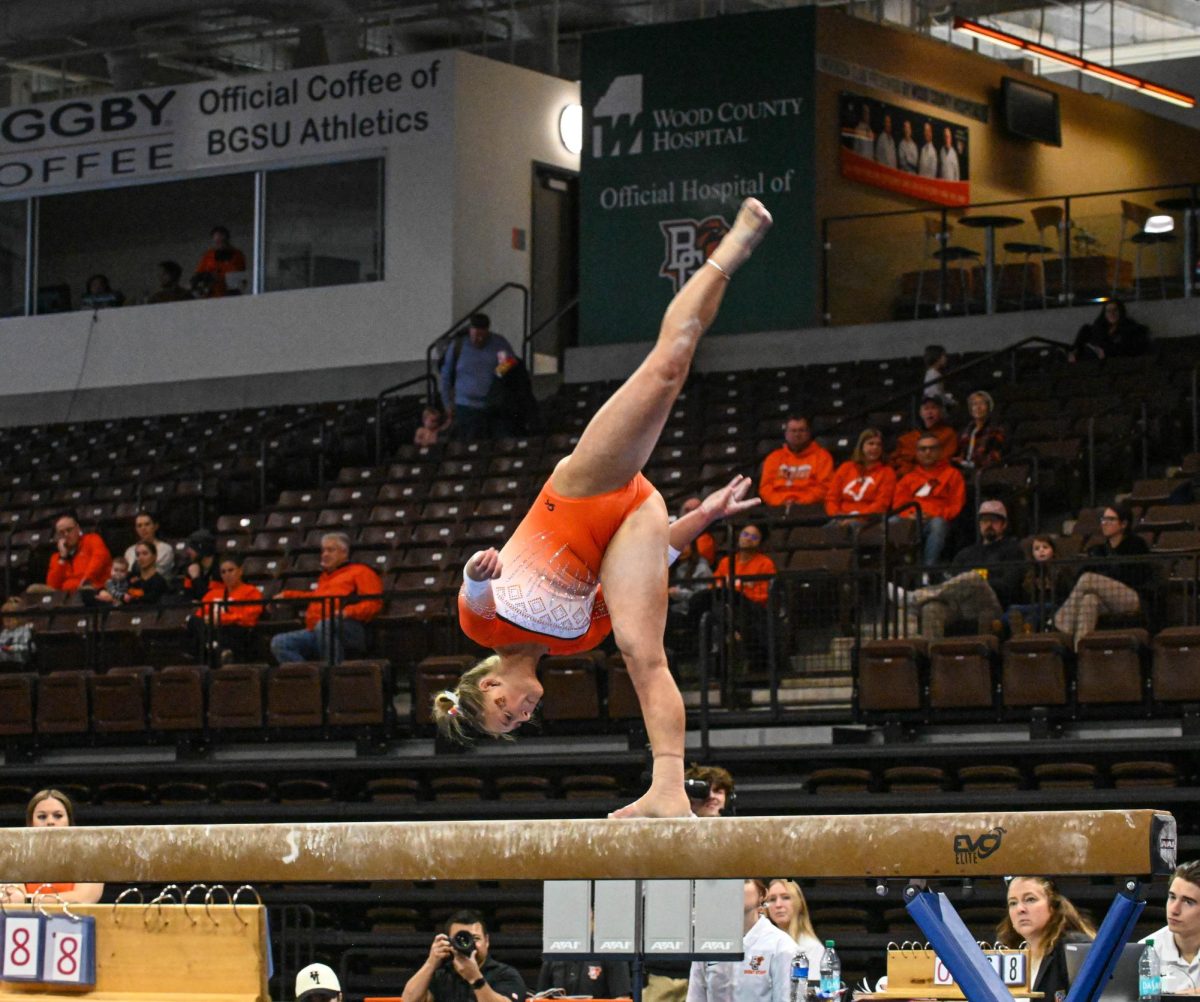 Bowling Green, OH - Falcons gymnast senior Madison Coburn working on the balance beam to improve the score for the falcons against the Eastern Michigan Eagles at the Stroh Center in Bowling Green, Ohio.