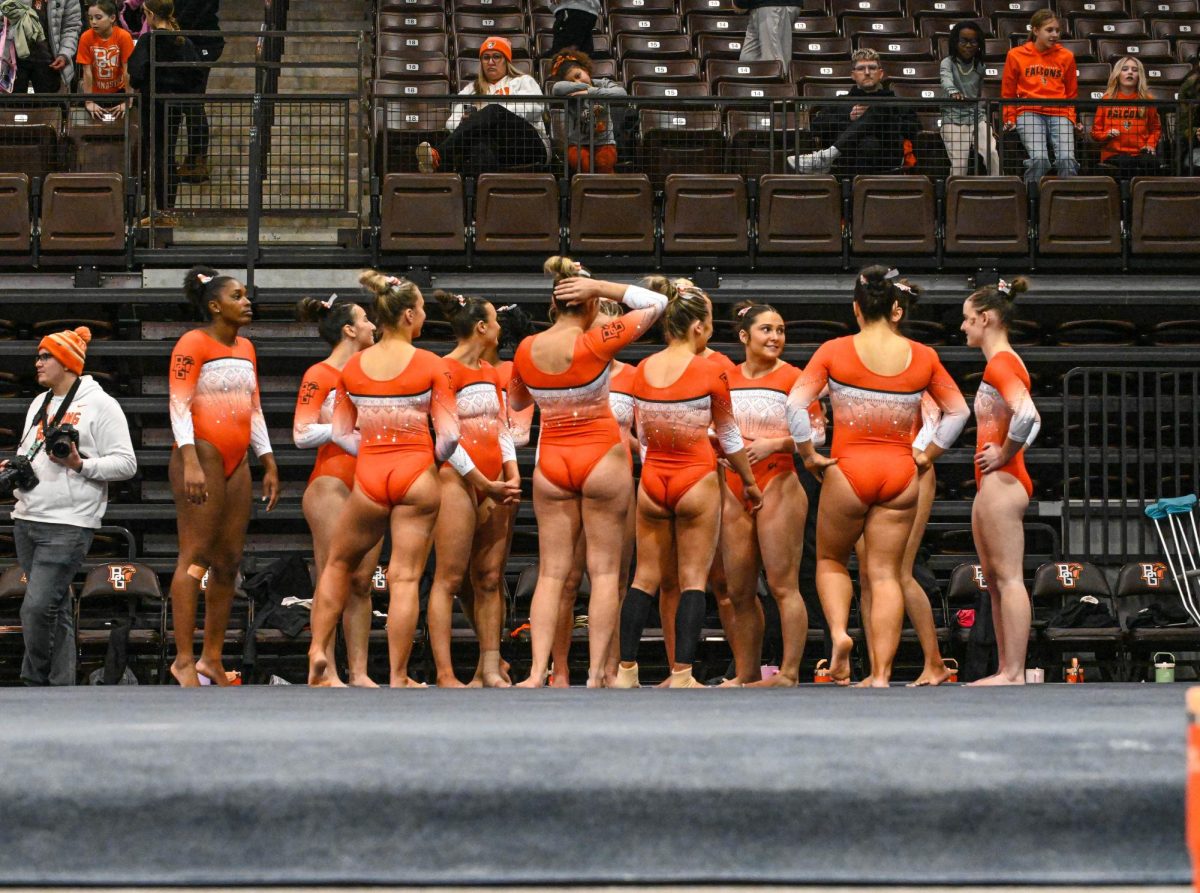 Bowling Green, OH - The Falcons gymnastics team huddled together at the end of their meet against the Eastern Michigan Eagles at the Stroh Center in Bowling Green, Ohio.