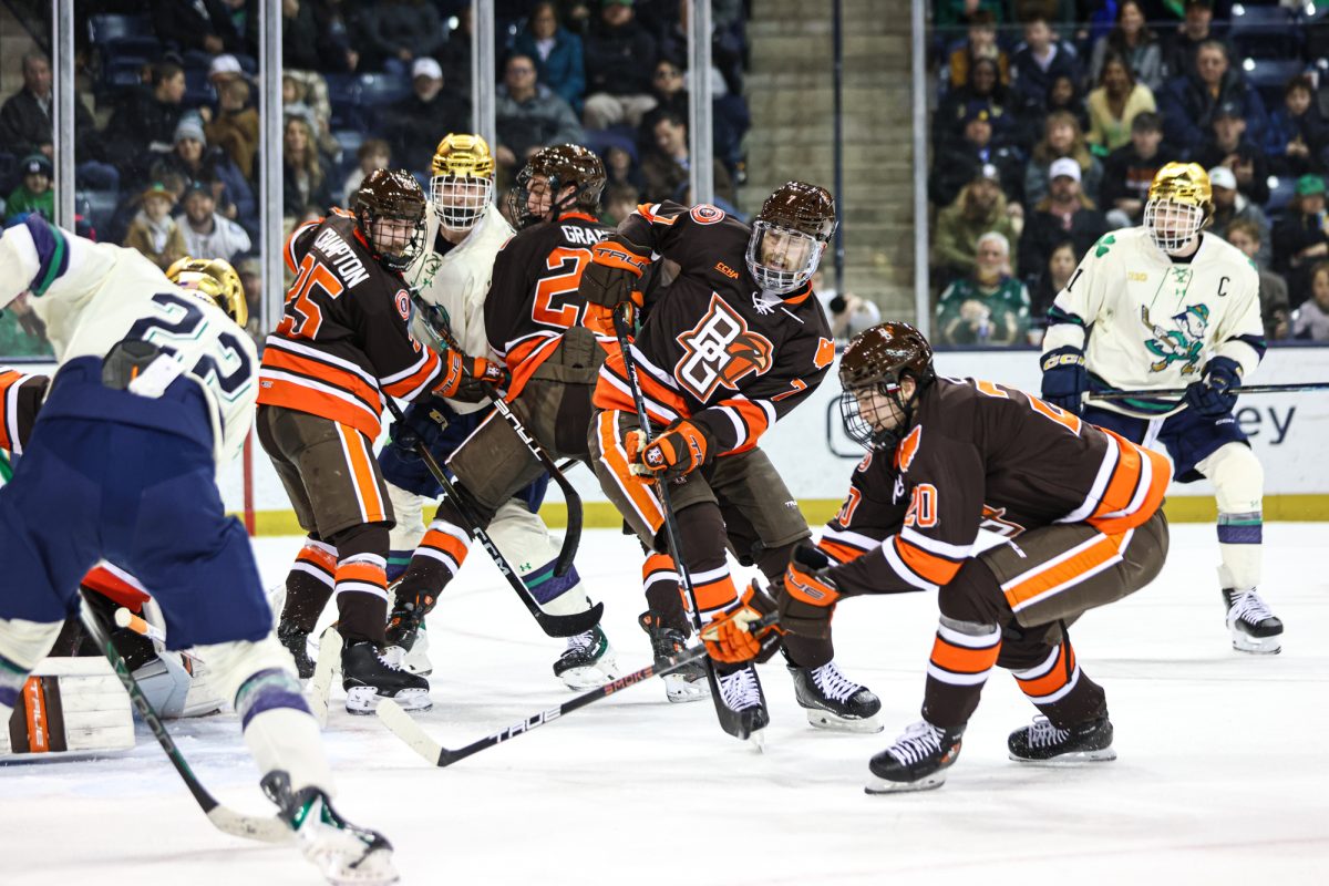 South Bend, IN - Multiple Falcons work to prevent a Notre Dame goal at the Compton Family Ice Arena in South Bend, Indiana.