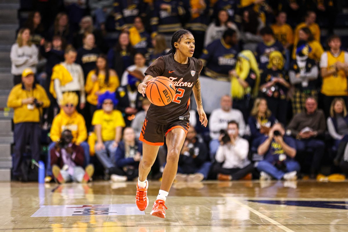 Toledo, OH - Falcons freshman guard Ky'Aira Miller (12) brings the ball down the court during the Battle of I-75 at the John F. Savage Arena in Toledo, Ohio.