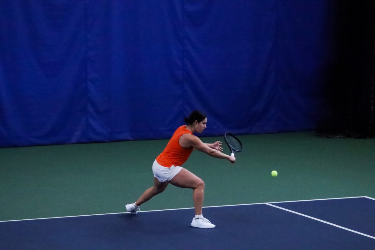 Perrysburg, OH - Falcons sophomore Konstantina Adamopoulou reaches to hit a backhand slice at the Perrysburg Tennis Center in Perrysburg, Ohio.