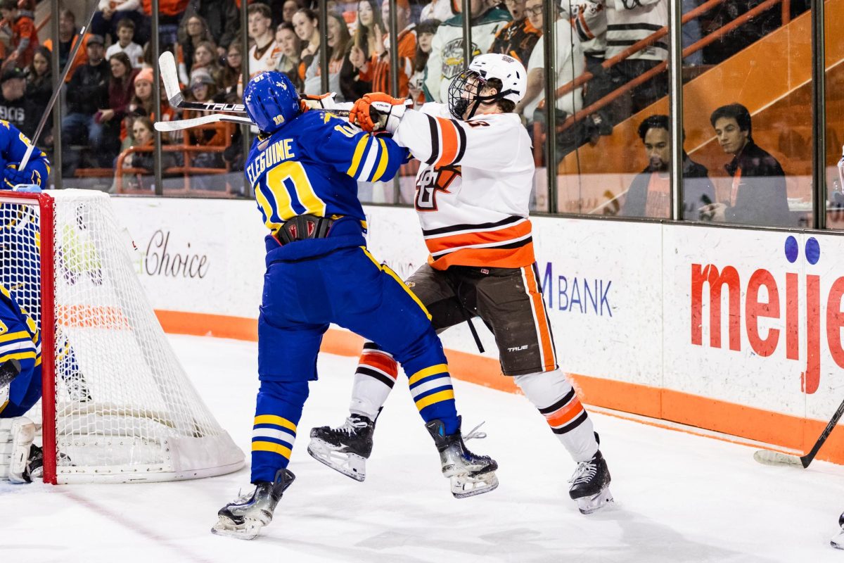  Bowling Green, OH - Falcons senior forward Quinn Emerson (18) and Lakers senior forward Sasha Teleguine (10) get handsy during a game between the Lake Superior State Lakers and the Bowling Green Falcons in Bowling Green, Ohio.