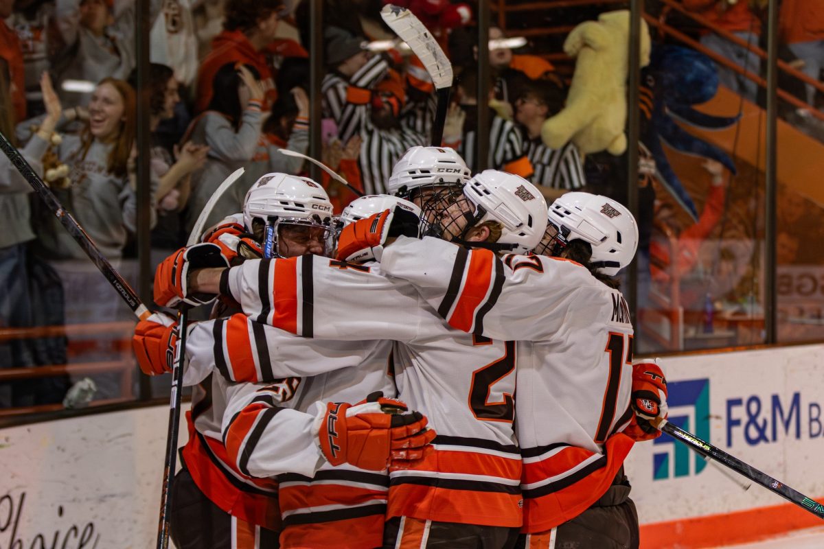 Bowling Green, OH - The Falcons celebrate after their first goal during a game between the Bowling Green Falcons and the Saint Thomas Tommies at the Slater Family Ice Arena in Bowling Green, Ohio.