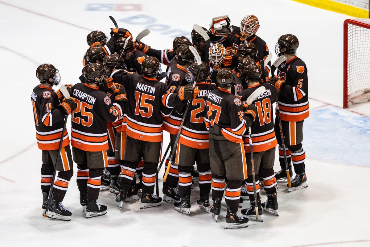 Houghton, MI - The Falcons mob Falcons sophomore goalie Tyler Palmer (31) after a shut-out win against the Michigan Tech Huskies at the John MacInnes Student Ice Arena, in Houghton, Michigan.