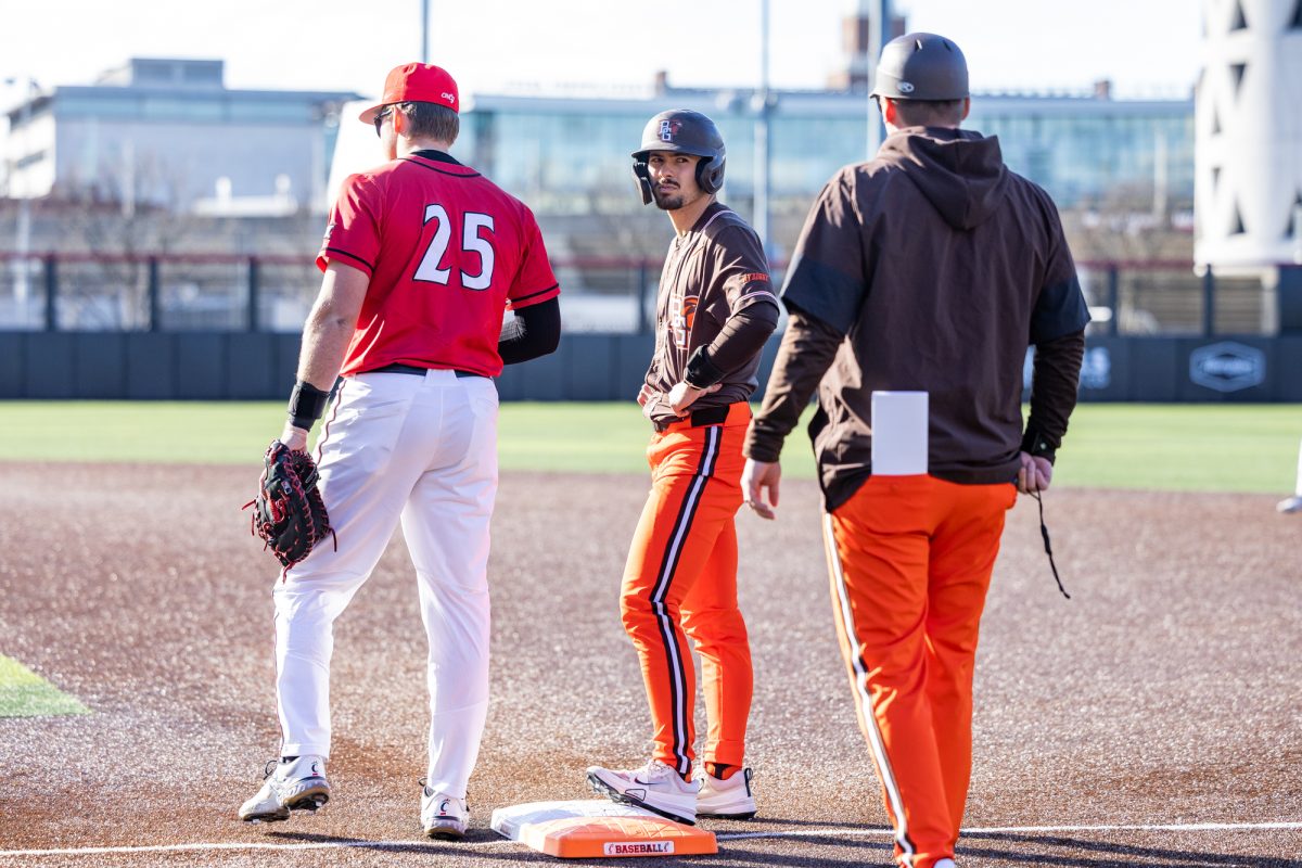 Cincinnati, OH - Falcons senior infielder Sam Seidel (21) talks to first-base coach Jordan Barchus during a game between the Bowling Green Falcons and the Cincinnati Bearcats at UC Baseball Stadium in Cincinnati, Ohio.