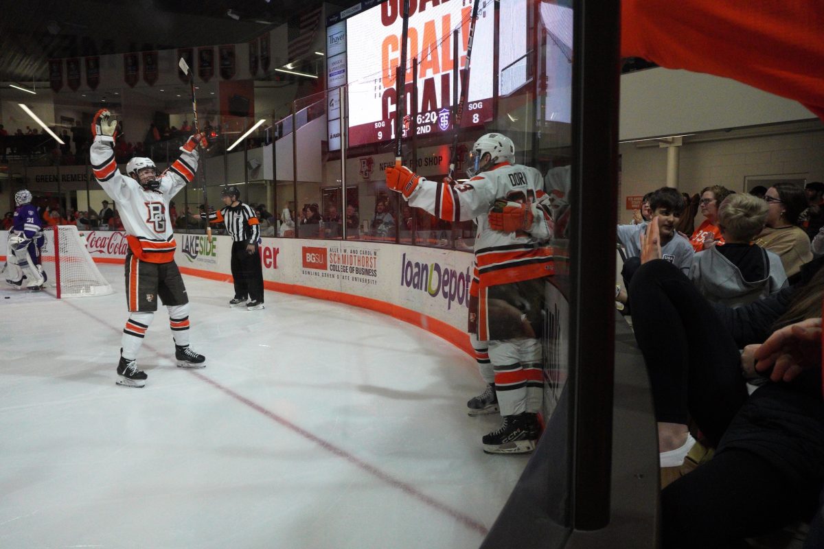 Bowling Green, OH - The falcons team celebrates a goal scored against the St. Thomas Tommies at the Slater Family Ice Arena in Bowling Green, Ohio.