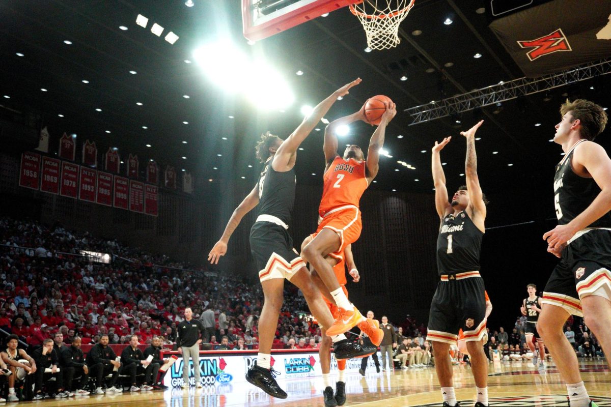 Oxford, OH - Falcons senior guard Javontae Campbell (2) shoots the ball over opposing defenders in a game against the Miami Redhawks at Millett Hall in Oxford, Ohio.