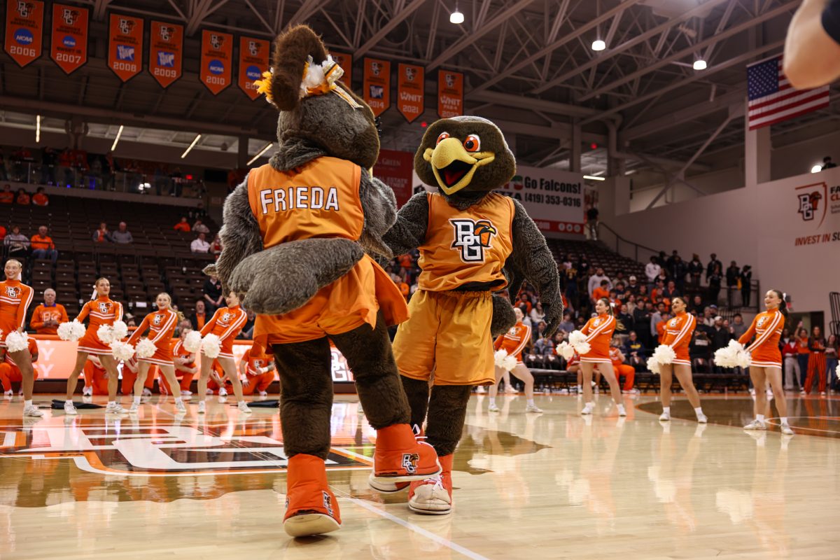 Bowling Green, OH - Freddie and Frieda Falcon dance prior to their identities being unveiled at the Stroh Center in Bowling Green, Ohio.