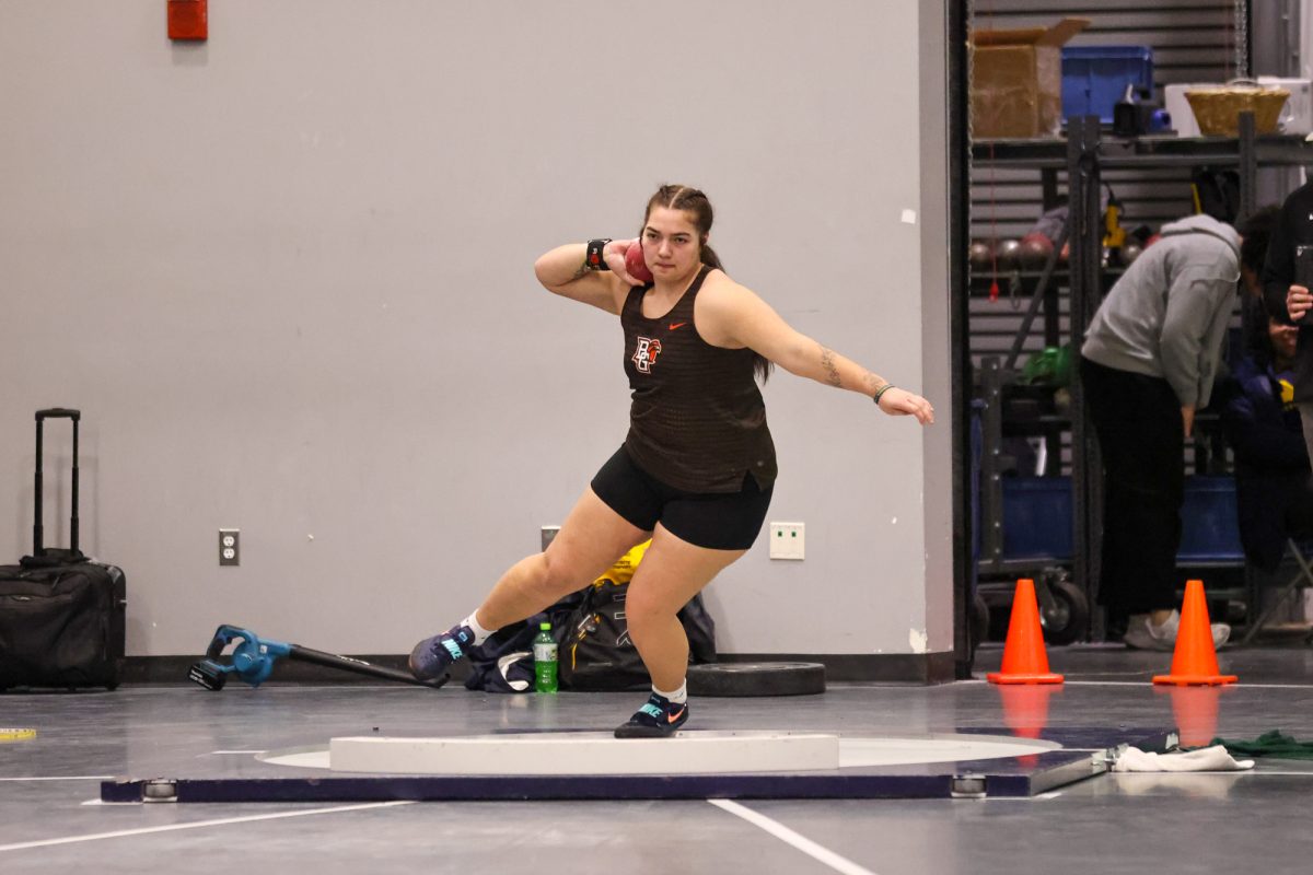 Ann Arbor, MI - Falcons sophomore Sierra Brinson winds up to throw during the Silverston Invitational at the Stephen M. Ross Athletics South Competition and Performance Center in Ann Arbor, Michigan.