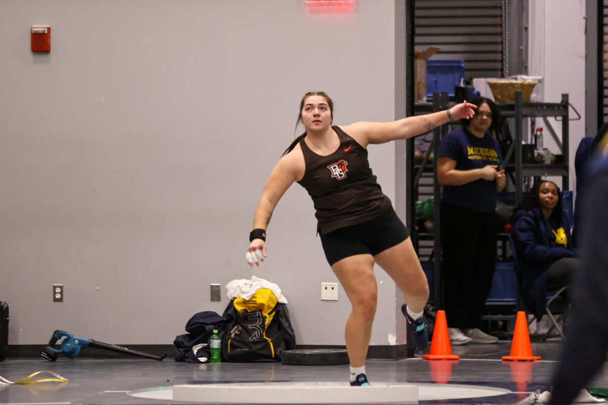 Ann Arbor, MI - Falcons sophomore Sierra Brinson watches the shot fly during the Silverston Invitational at the Stephen M. Ross Athletics South Competition and Performance Center in Ann Arbor, Michigan.