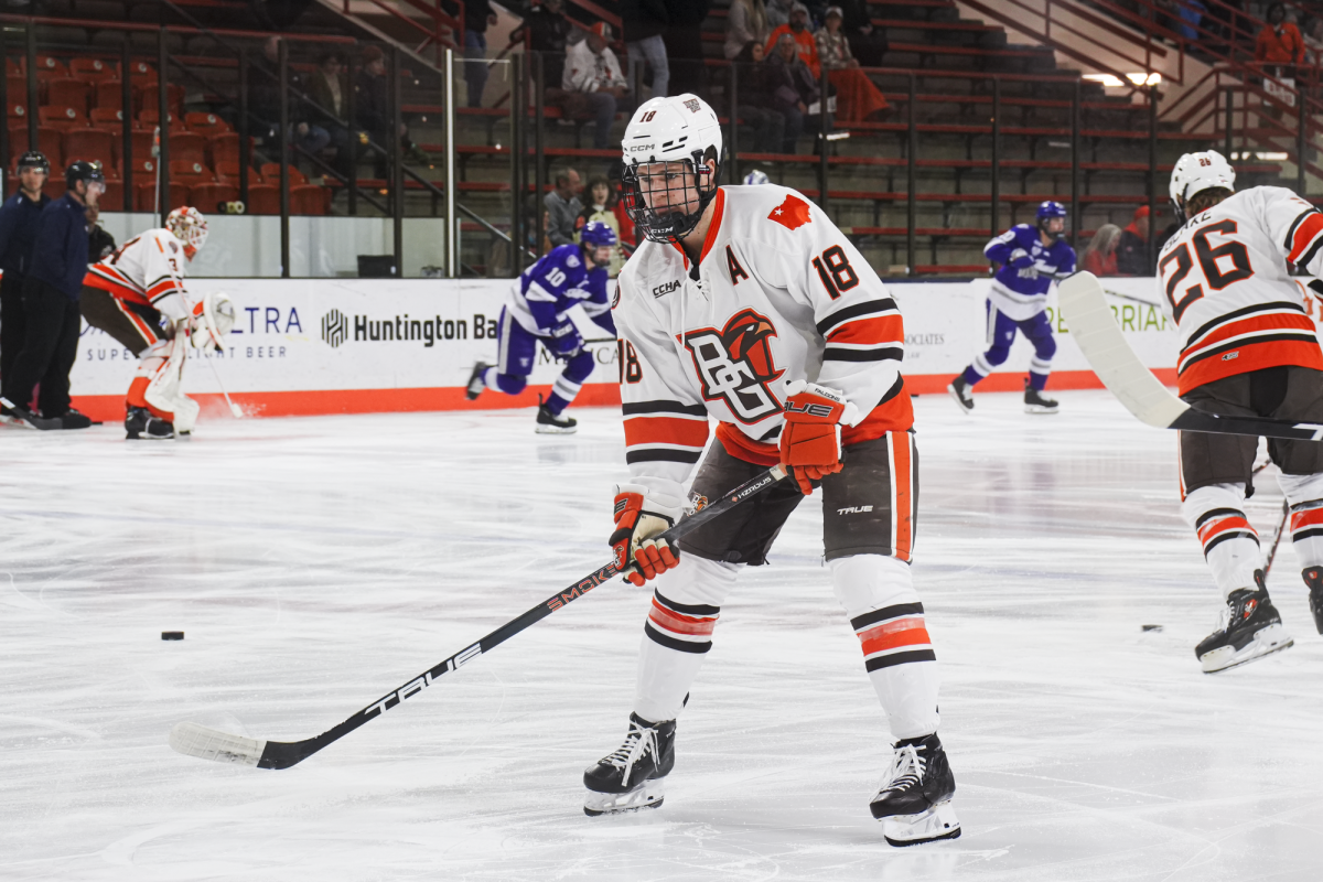 Bowling Green, OH - Falcons senior forward Quinn Emerson (18) warms up for a game at Slater Family Ice Arena in Bowling Green, Ohio.