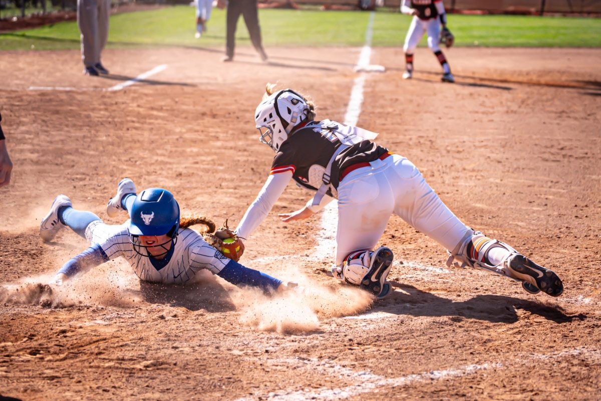 Bowling Green, OH -Falcons senior catcher Ashley Chevalier (14) making the tag at home plate during a game between the Buffalo Bulls and the Bowling Green Falcons at Meserve Field in Bowling Green, Ohio.