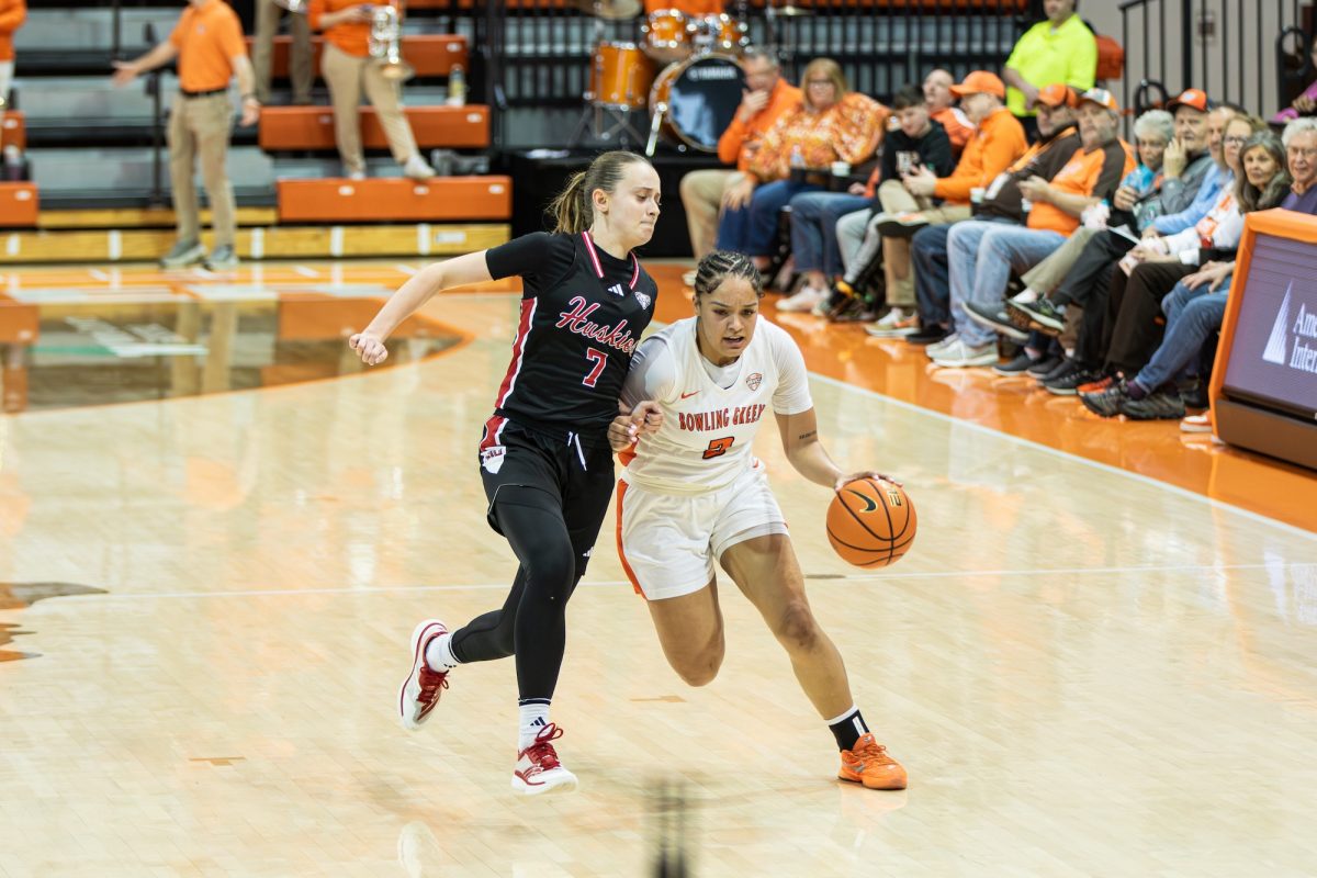 Bowling Green, OH - Falcons sophomore guard Johnea Donahue (3) pushes through her defender Huskies senior guard Maria Serracanta (7)during a game between the Bowling Green Falcons and the Northern Illinois Huskies at the Stroh Center in Bowling Green, Ohio.