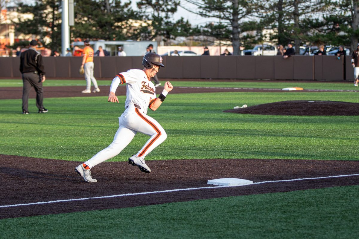 Bowling Green, OH - Falcons freshman infielder Griffin Scheiderer (18) rounds third base during a game between the Bowling Green Falcons and Findlay Oilers at Stellar Field  in Bowling Green, Ohio.