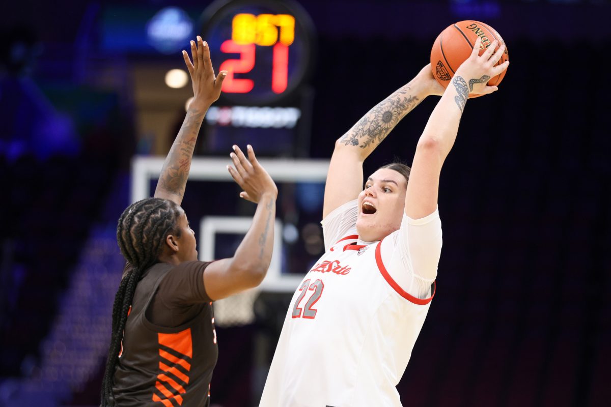 Cleveland, OH - Cardinals senior Tessa Towers (22) tries making a pass during the women's MAC Basketball Tournament at Rocket Arena in Cleveland, Ohio.