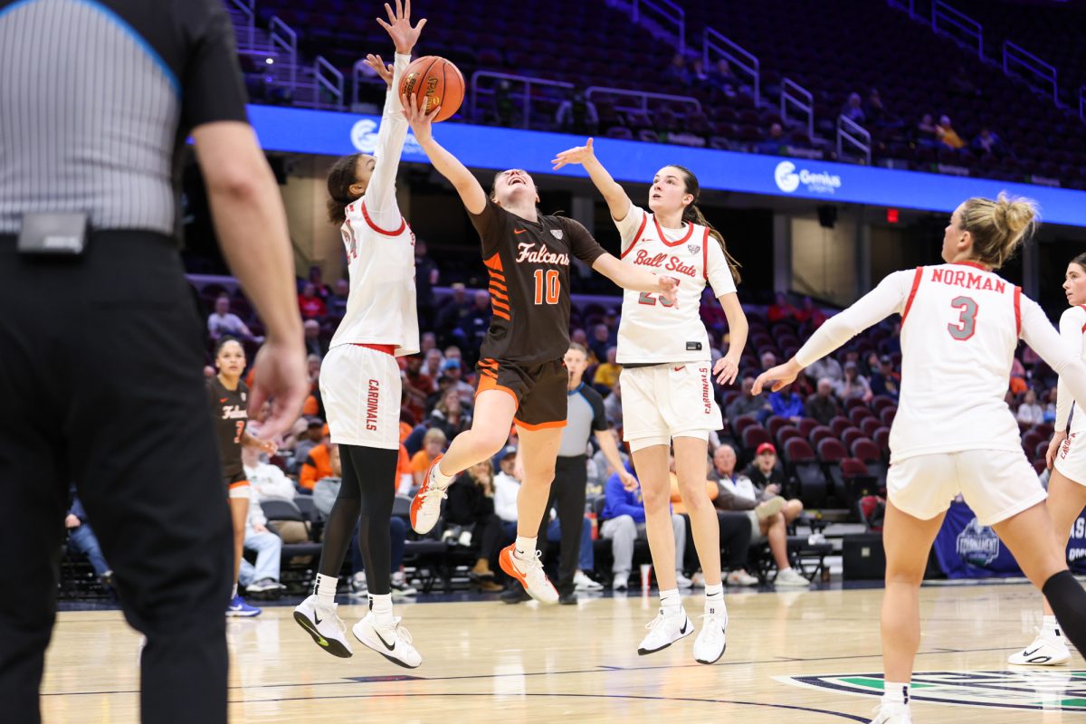 Cleveland, OH - Falcons junior guard Paige Kohler (10) shoots a contested layup during the women's MAC Basketball Tournament at Rocket Arena in Cleveland, Ohio.