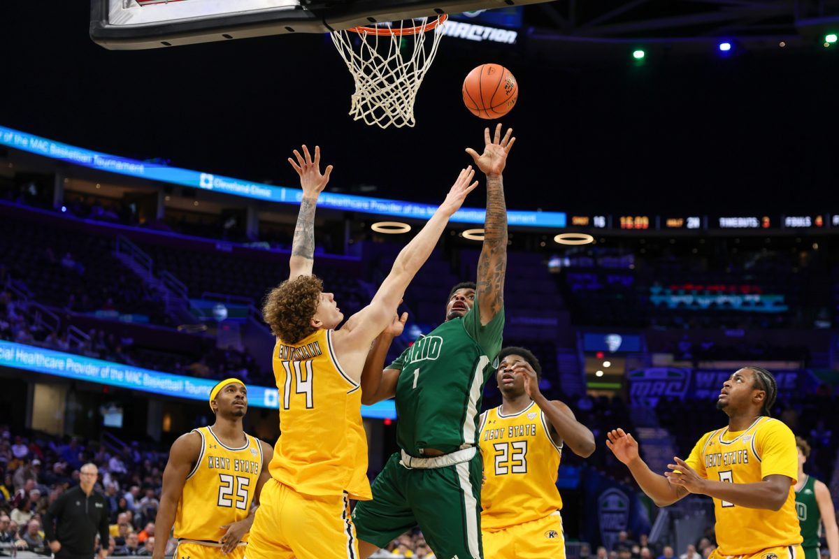 Cleveland, OH - Bobcats redshirt junior forward Javan Simmons (1) shoots a contested layup during the men's MAC Basketball Tournament at Rocket Arena in Cleveland, Ohio.
