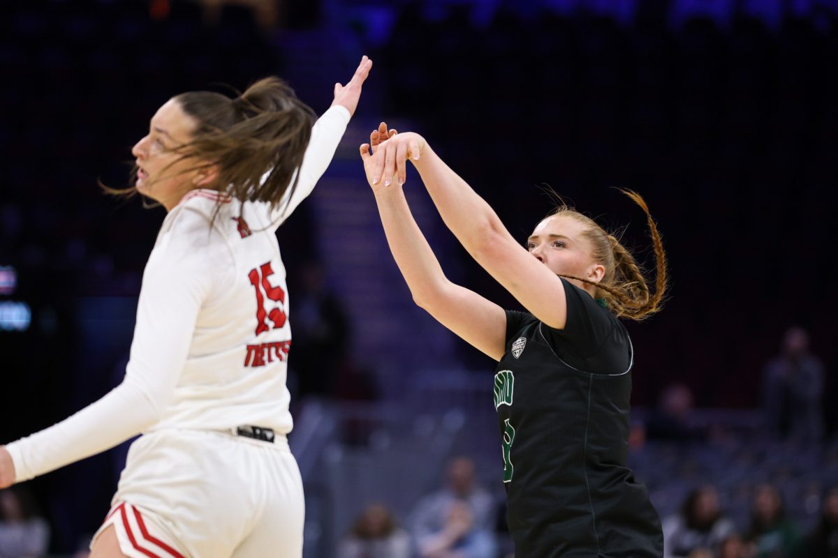 Cleveland, OH - Bobcats graduate forward Elli Garnett (8) shoots from deep during the women's MAC Basketball Tournament at Rocket Arena in Cleveland, Ohio.